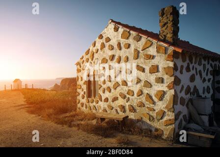 House on the cliff of the Atlantic Ocean coast in the Alentejo region of Portugal Stock Photo