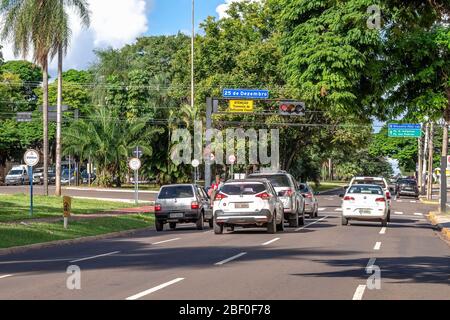 Campo Grande - MS, Brazil - March 30, 2020: Traffic of cars at Afonso Pena avenue corner with December 25 street. Stock Photo