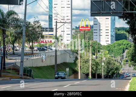 Campo Grande - MS, Brazil - March 30, 2020: Traffic of cars at Afonso Pena avenue next to the city mall. Stock Photo