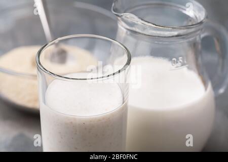 A glass of fresh kefir with oat bran, close-up. Concept of useful dairy products for the human digestive system Stock Photo