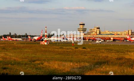 BERLIN, GERMANY - JUL 06th, 2015: Berlin Tegel Otto Lilienthal Airport TXL control tower and main terminal building during sunset Stock Photo