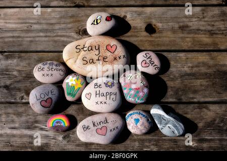 Pebble art on a weathered timber background Stock Photo