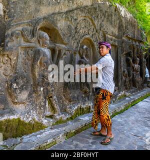 Square portrait of a local tour guide at Yeh Pulu Relief in Bali, Indonesia. Stock Photo