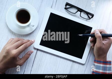 young man using digital tablet on table  Stock Photo