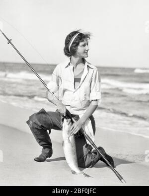African American twenties woman with a fishing pole at Myrtle Beach pier  Stock Photo - Alamy, beach lady fishing