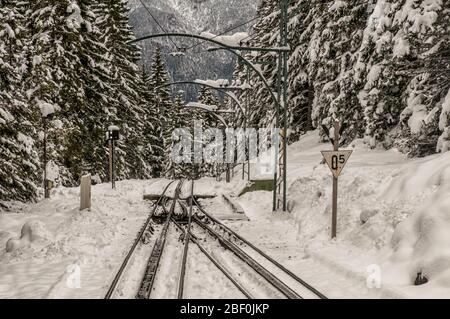 The Zugspitzbahn railway tracks in winter Stock Photo