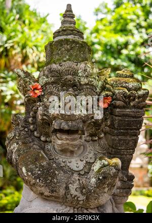 Vertical close up view of a gate guardian statue at Ubud palace in Bali, Indonesia. Stock Photo