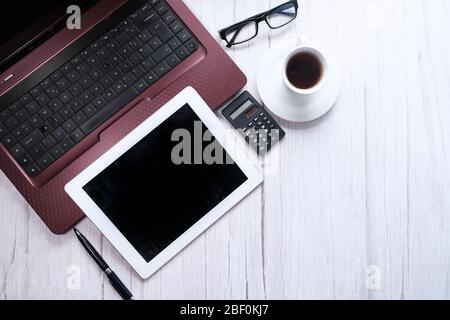 top view of digital tablet with blank screen and laptop on table  Stock Photo