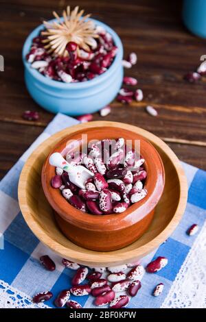 Violet with dots beans in ceramic bowl. Swallow beans. Vegetables for healthy eating. Organic food. Diet Stock Photo