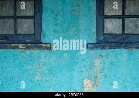 wall with dark blue window frames Stock Photo