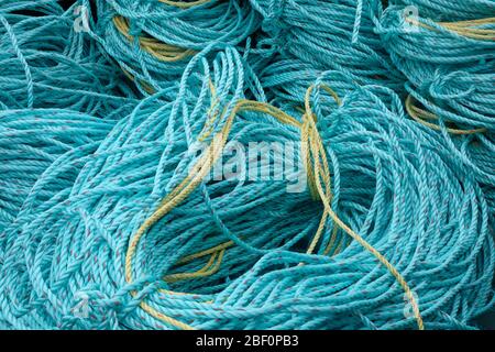 fishermen's rope coiled up on the harbourside Stock Photo