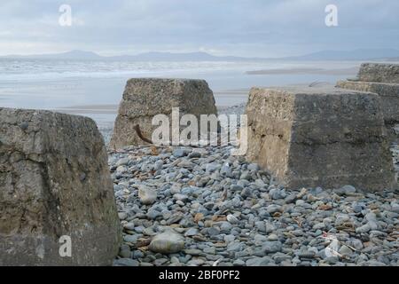 World War 2 Tank Traps on the beach at Fairbourne on the NW coast of Wales Stock Photo