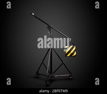 Photo studio lighting stands isolated on the black background. Stock Photo