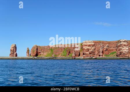 View from the water to the red sandstone rocks with Langer Anna, Helgoland, North Sea, Schleswig-Holstein, Germany Stock Photo