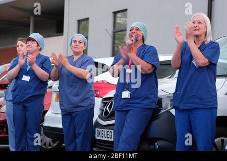 Hereford, Herefordshire, UK – Thursday 16th April 2020 – NHS staff step outside the A&E unit at the County Hospital in Hereford at 8pm to clap for their colleagues and other key emergency workers for the fourth consecutive Thursday since the Coronavirus Covid-19 lockdown started. Photo Steven May / Alamy Live News Stock Photo