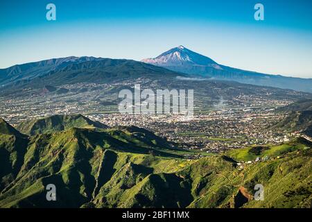 Anaga rural park with the emblematic Mount Teide in the background seen from Mirador de la Cruz del Carmen viewpoint. Tenerife, Canary Islands, Spain. Stock Photo