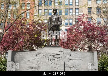 Farragut Monument is surrounded by beautiful spring trees in Madison Square Park, NYC, USA Stock Photo