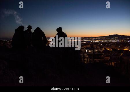Athens, Greece. 16th Apr, 2020. Youngsters hang out on one of Athens' hills. Greece on lockdown since March 22nd counts to date 2207 confirmed Covid-19 cases and 105 fatalities. Credit: Nikolas Georgiou/ZUMA Wire/Alamy Live News Stock Photo