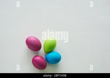 Painted multicolored eggs against a light background.Diet, protein, protein. Preparing for Easter. Stock Photo