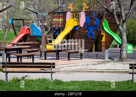 View of empty slides at colourful playground during the Coronavirus pandemic Covid-19 lockdown in Sofia, Bulgaria, Eastern Europe, Balkans, EU as of 2020 Stock Photo