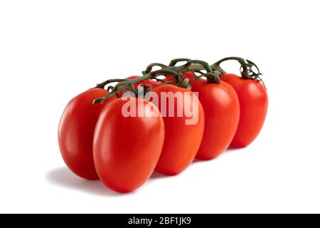 Oblong fresh red tomatoes isolated on a white background with clipping paths with shadow and without shadow Stock Photo