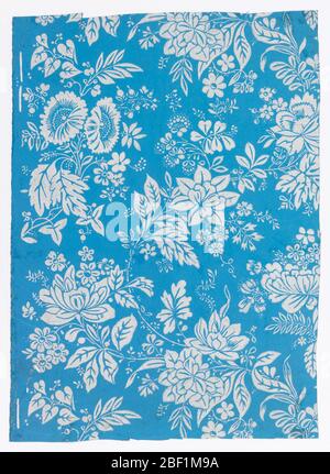Sidewall. Overall various floral and leaf motifs. Printed in grey and white on a blue ground. Stock Photo
