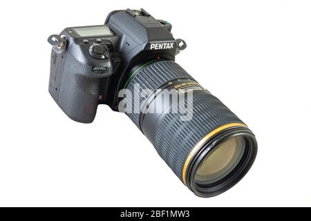 West St. Paul, MN/USA - April 14, 2020: Pentax brand digital SLR camera model K5 and zoom lens attached isolated against white. Stock Photo
