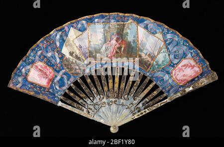 Pleated fan. Pleated fan. Leaf of painted parchment backed with painted paper; sticks of incised and pierced mother-of-pearl with applied metallic foil; glass stone at the rivet. Stock Photo