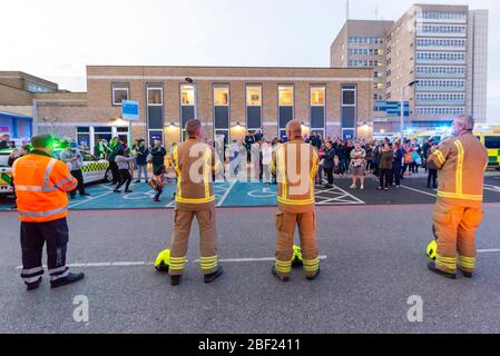 Firefighters clapping at Clap for Carers at 8pm outside Southend Hospital in evening to thank NHS and key workers during the COVID-19 Coronavirus. RAC Stock Photo