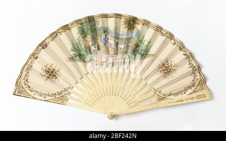 Pleated fan. Fan with paper leaf with hand-colored and gilded lithograph print depicting lovers (or shepherd and shepherdess) in a pastoral landscape. Stock Photo