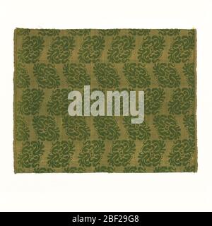 Fragment. Diagonal green leaves on yellow background.Selvage on both sides. Stock Photo