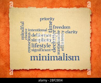 cloud of words associated to minimalism as a lifestyle - handwriting on a handmade rag paper, simplify and declutter concept Stock Photo