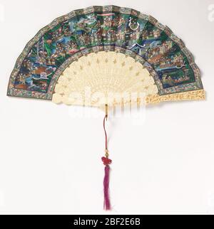 Pleated fan. Pleated fan. Painted paper leaf showing village scene; figures with appliquéd silk costumes and painted ivory faces. Ivory sticks pierced and carved à jour. Gilt metal bail with knotted red and purple silk tassel. Stock Photo