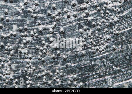 Boiling water bubbles close up. abstract texture with water drops on steel plate. gray rough background Stock Photo