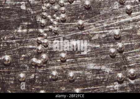 Boiling water bubbles close up. abstract texture with water drops on steel plate. gray rough background Stock Photo