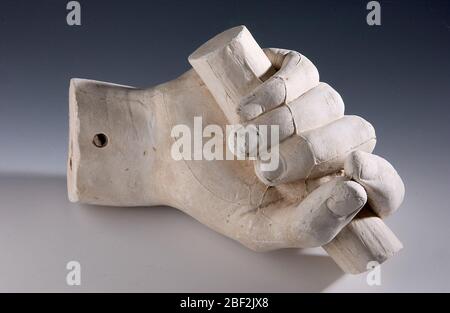 Cast of an Unidentified Right Hand Grasping a Rod. There are many plaster fragments of anatomical details in the Hiram Powers collection that cannot be identified. Stock Photo
