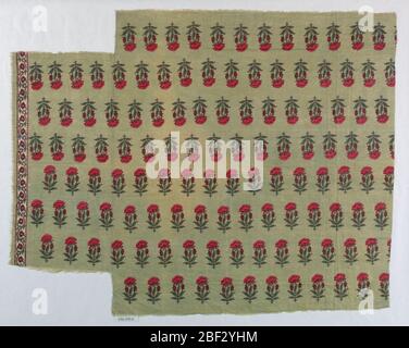 Textile. Fragment in red and green on light green ground. Stylized, allover floral pattern of a poppy seed plant. One border stripe present showing small-scale floral design on white background. Stock Photo