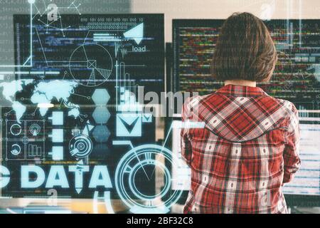 Female programmer working in office, back view Stock Photo