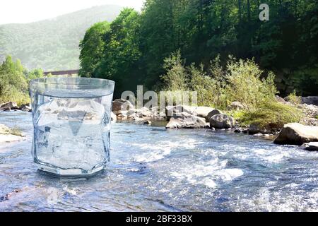 Double exposure of nature and glass of pure water Stock Photo