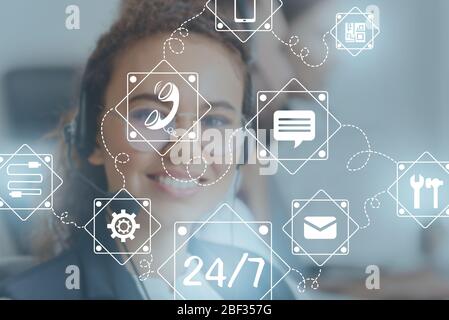 Technical support agent and digital icons in office Stock Photo