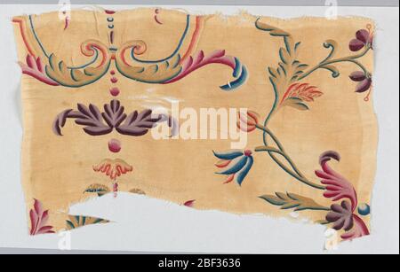 Fragment. Small section of a coverlet or hanging showing parts of delicately drawn twining stems, leaves, flowers, symmetrical leaf volutes, and graduated dots, in shades of purple, red, blue, yellow, orange, and green silk embroidered on an undyed ground with a small d Stock Photo