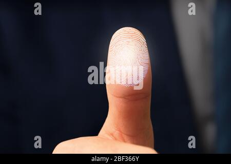 Businessman using fingerprint protection for data access, closeup Stock Photo
