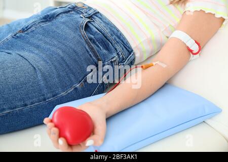 Woman donating blood in hospital Stock Photo