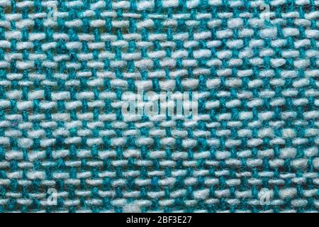 Fabric macro texture. knitted textile close up. woven background. woolen material. weaving blue and white threads Stock Photo