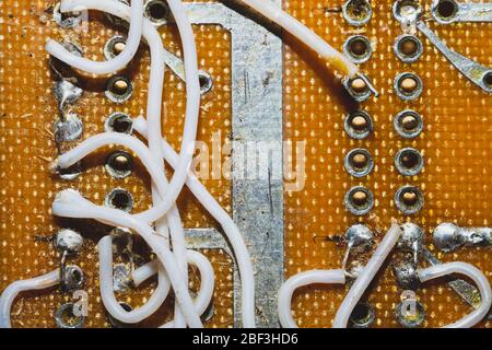 Handmade circuit board with connection wires. industrial background Stock Photo