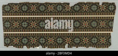 Border. Graduated pattern of stars and rosettes outlined in black flock. Colored dots of green, blue, orange-red and red, combine with gilt dots on a medium brown ground. Stock Photo