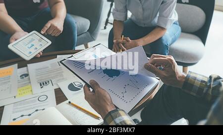 Start up partners are discussing the ideas for new strategy of development. Stock Photo