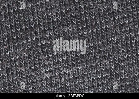 Black fabric texture. knitted textile close up. woven background Stock Photo