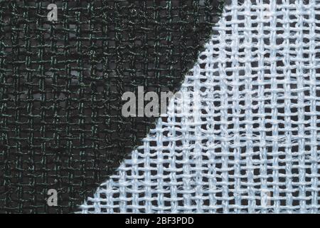 Fabric macro texture. knitted textile close up. woven background. black and white threads Stock Photo