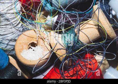 Tangled threads for sewing. different spools of thread Stock Photo